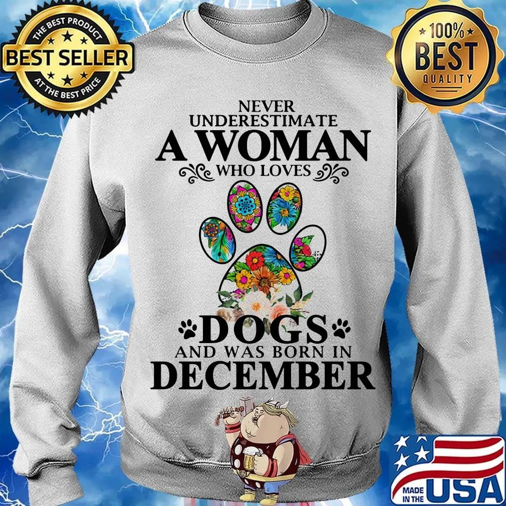 Never underestimate an old woman who loves dogs paw and was born in december s Sweater