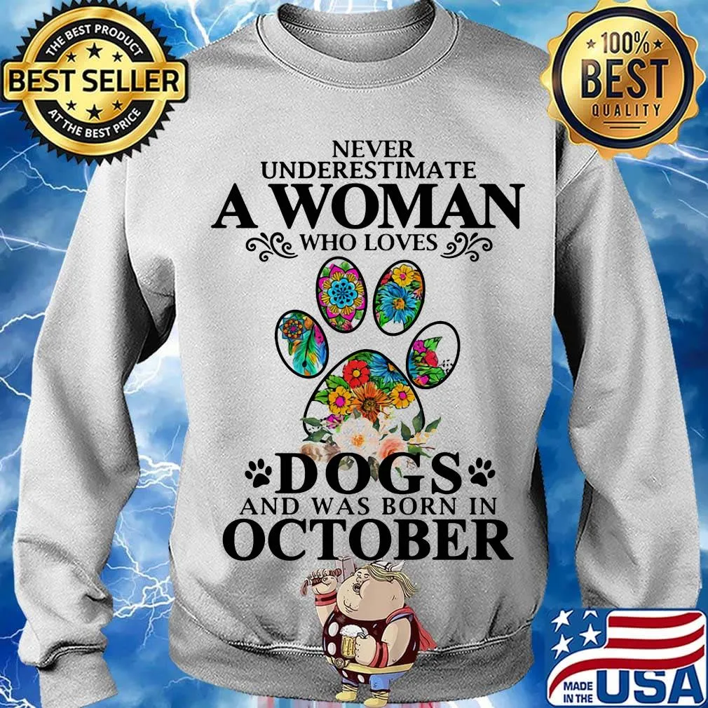 Never underestimate an old woman who loves dogs paw and was born in october s Sweater