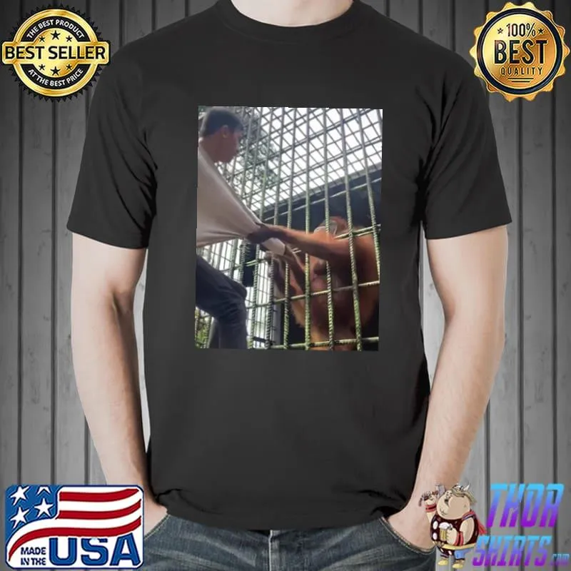 Orangutan grabs man indonesian zoo shirt