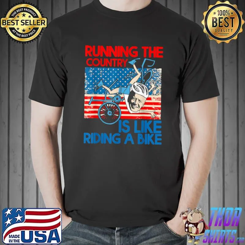 Anti Biden Falling Off Running The Country Is Like Riding A Bike Usa Flag T-Shirt