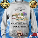 Never underestimate a lady who loves cross stitching and was born in december s Sweater