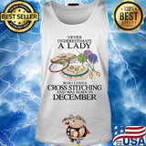 Never underestimate a lady who loves cross stitching and was born in december s Tank top