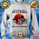 Never underestimate an old woman who loves mushing sunset s Sweater