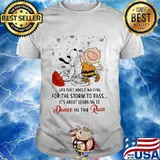 Life Isn’t About Waiting For The Storm To Pass Its About Learning To Dance In The Rain Snoopy And Charlie Shirt