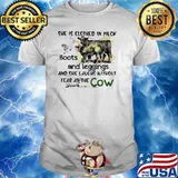 She Is Clothed In Muck Boots And Leggings And She Laughs Without Fear At The Cow Shirt