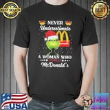 Grinch Santa Hat Never Underestimate A Woman Who Works At McDonald’s Merry Christmas Shirt Unisex