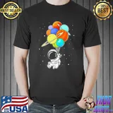 Astronaut holding planet balloons space shirt