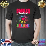 Smiles Begin At Age One Pediatrician Nurse Peds Pediatric Hands Colors T-Shirt