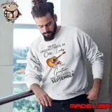 Never underestimate an old lady loves guitar was born in September flower shirt